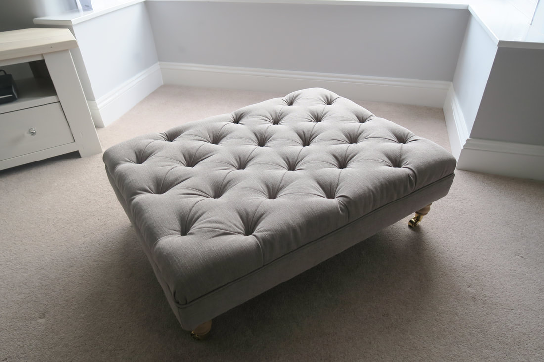 Large grey, deep buttoned footstool